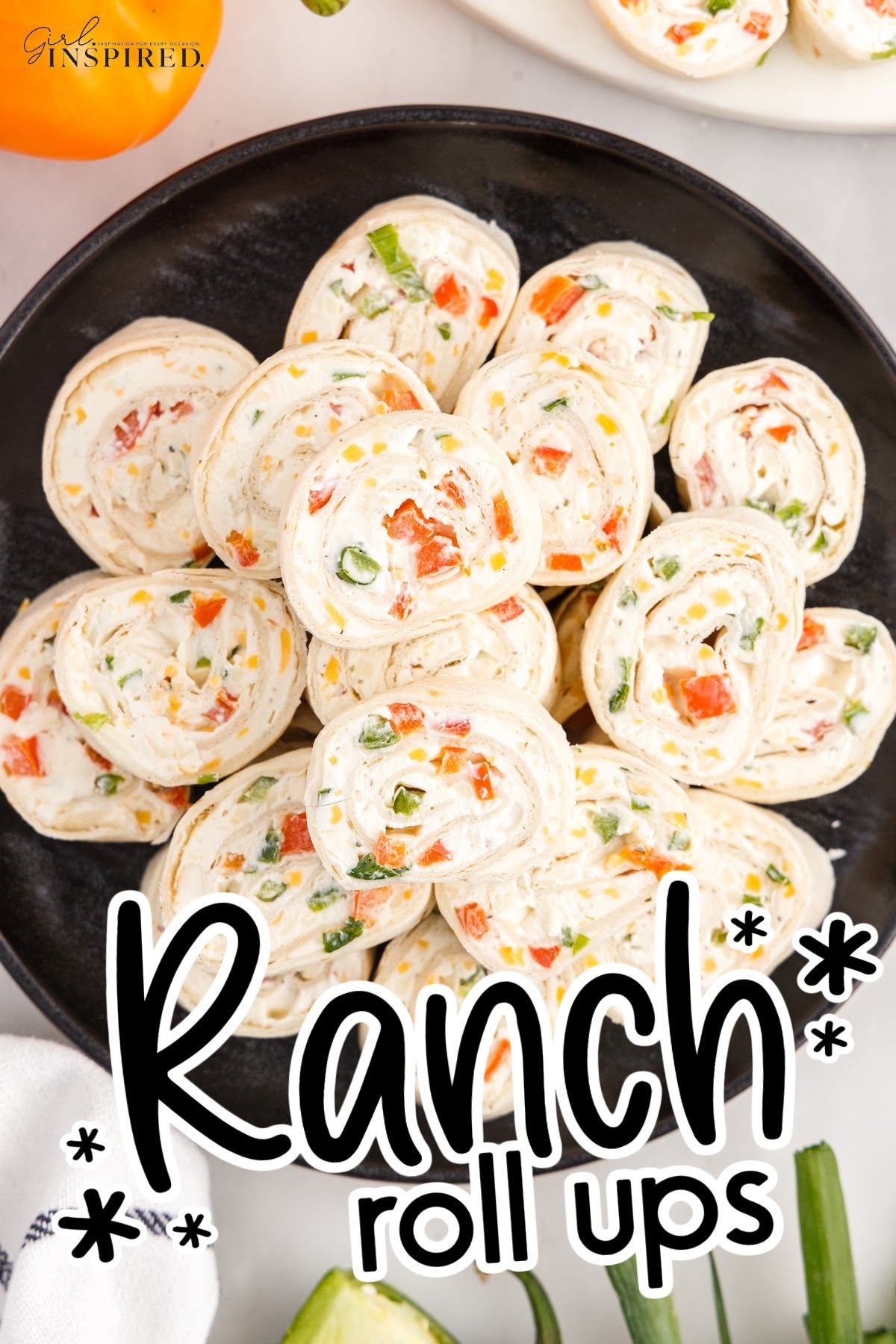 Ranch Pinwheels on a black plate with text overlay.
