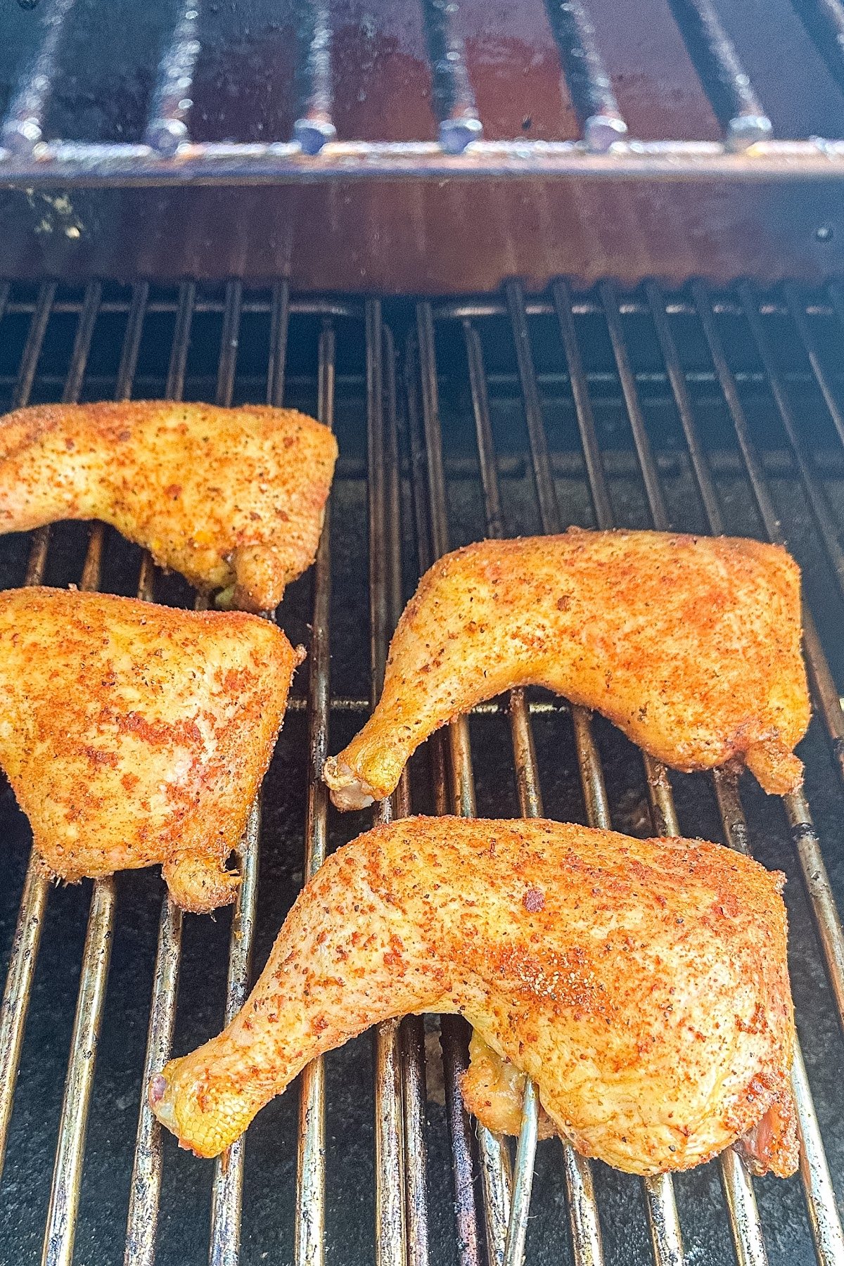 Chicken leg quarters on the grill.