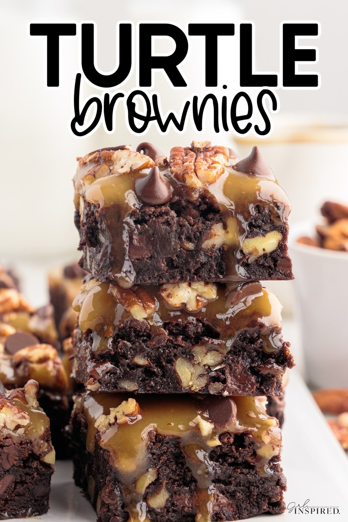 Turtle Brownies stacked on top of each other with text overlay.