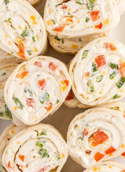 Sliced ranch pinwheels on a white plate.