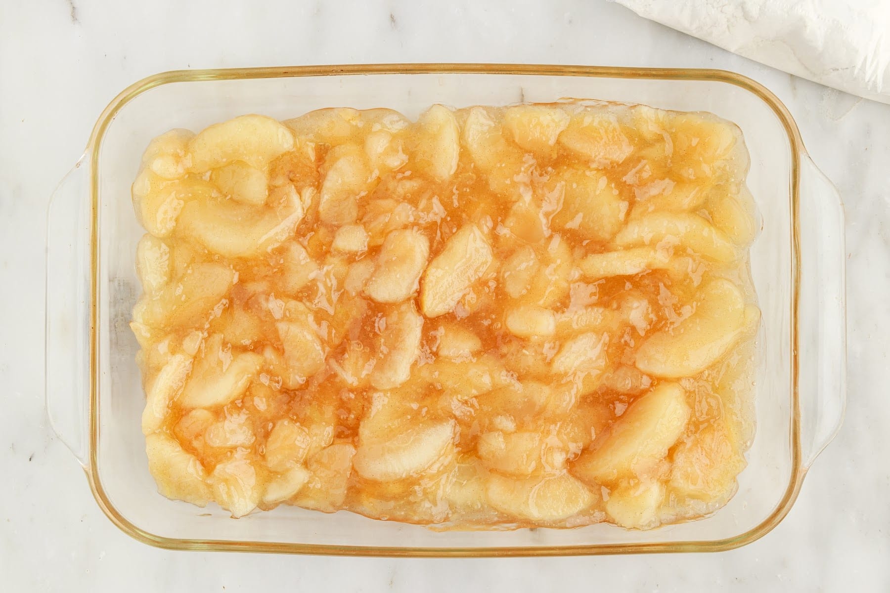 Apples in a 9x13 baking dish.