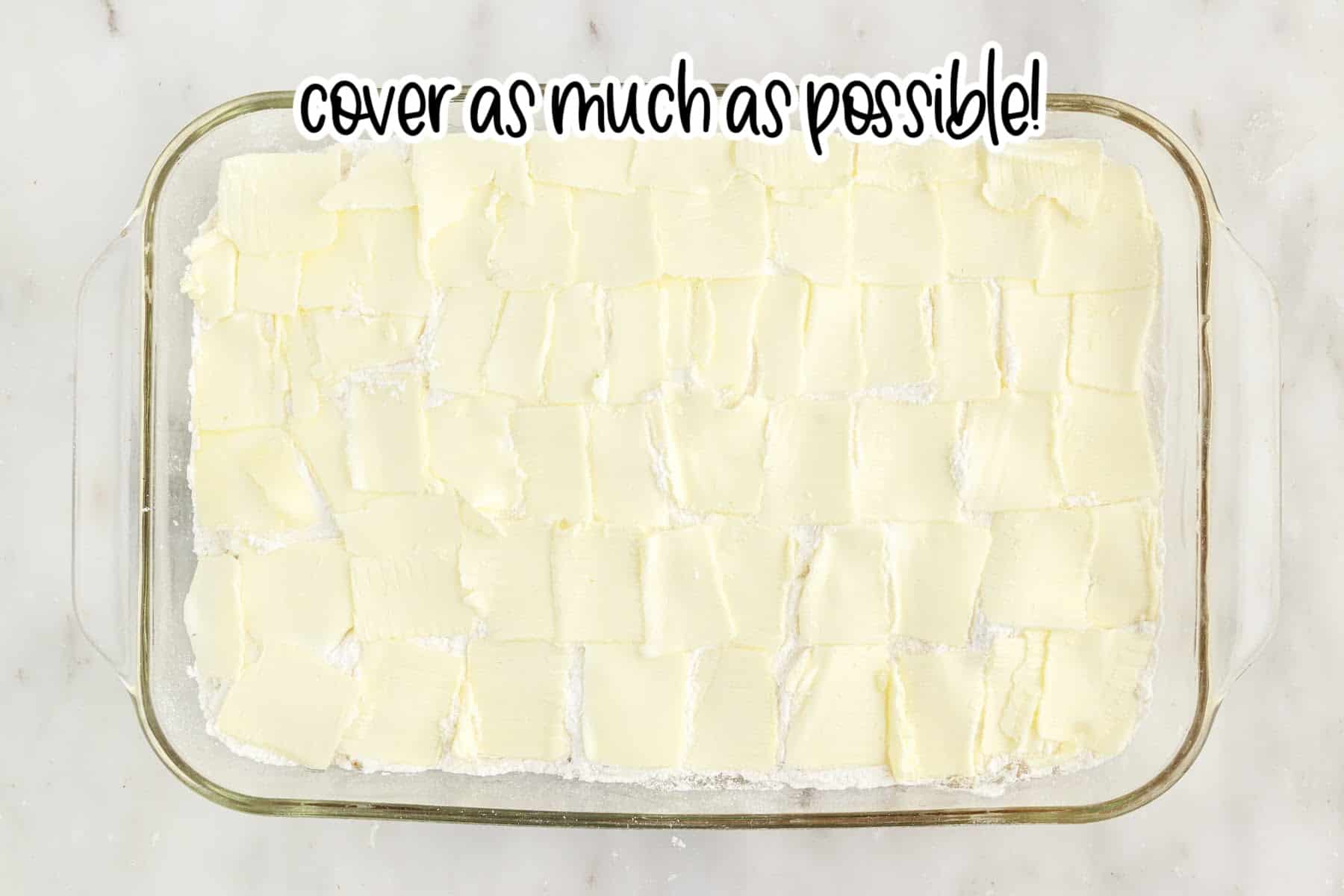 Butter layered on cake mix with text overlay.