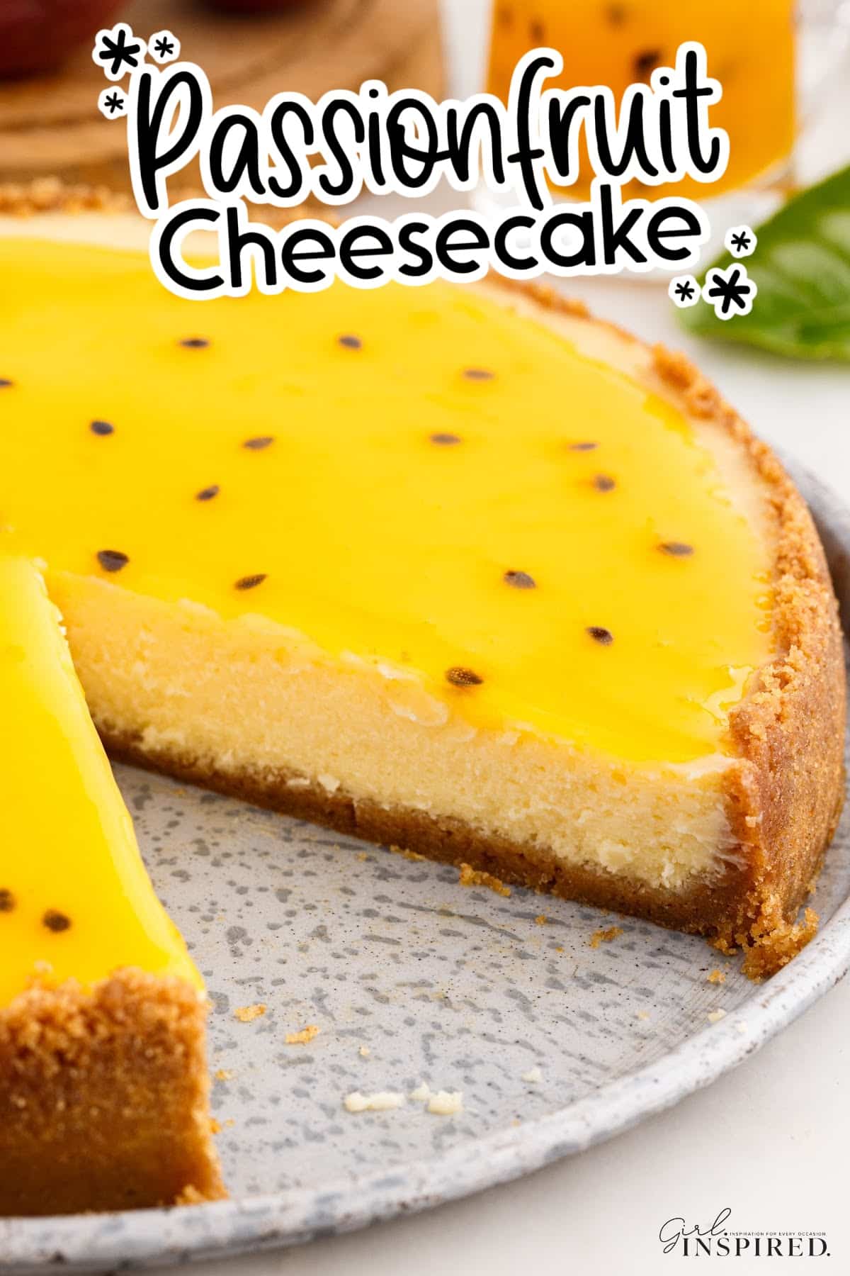 Passionfruit Cheesecake with a slice missing with text overlay.