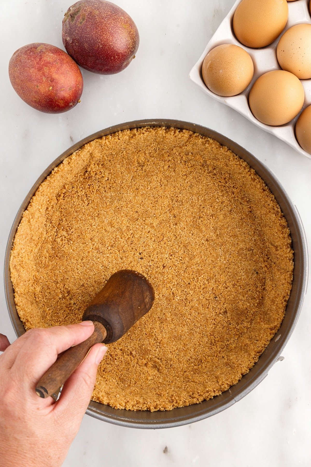 Graham crust pressed down in springform pan.