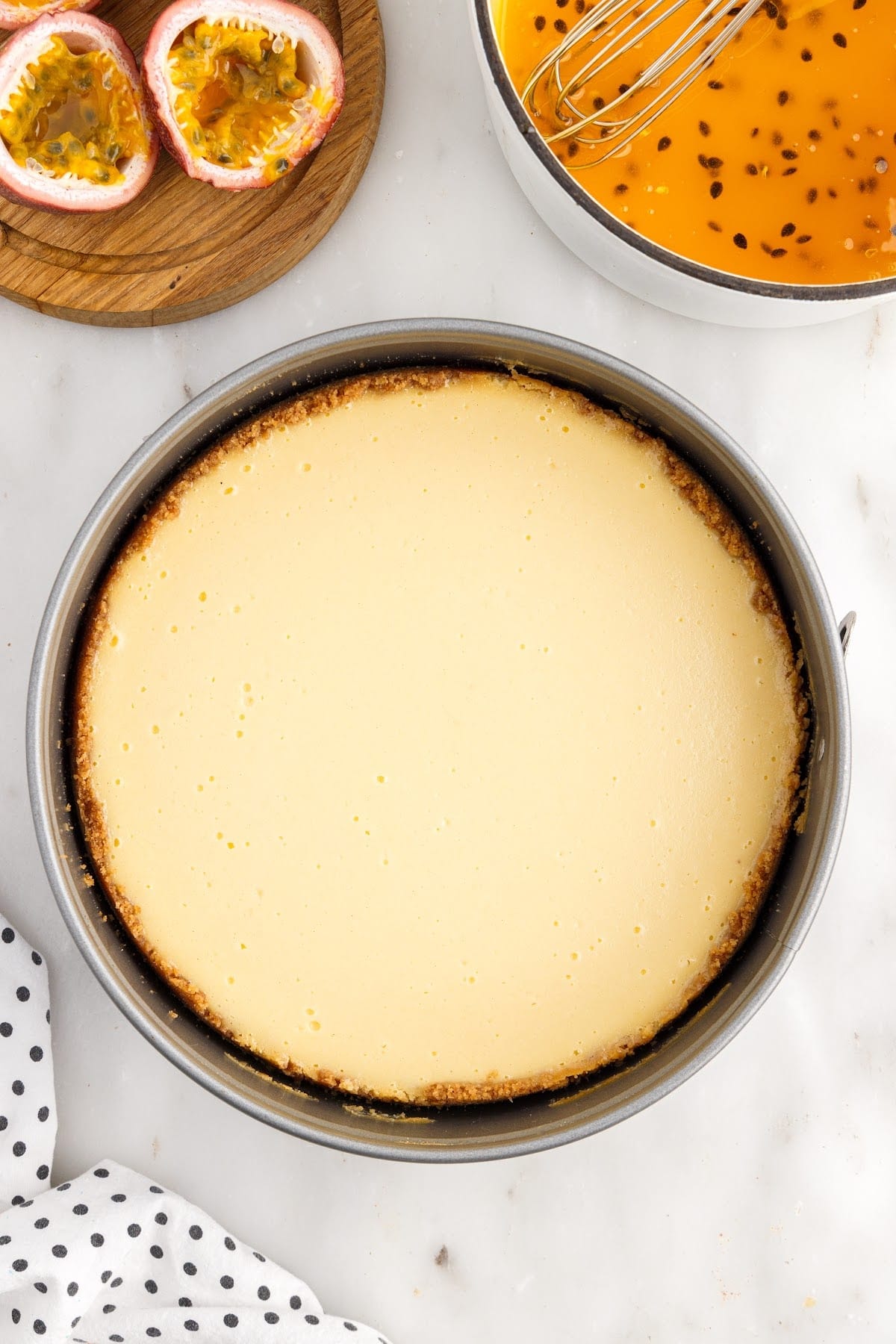 Overhead view of Passionfruit Cheesecake in a springform pan.