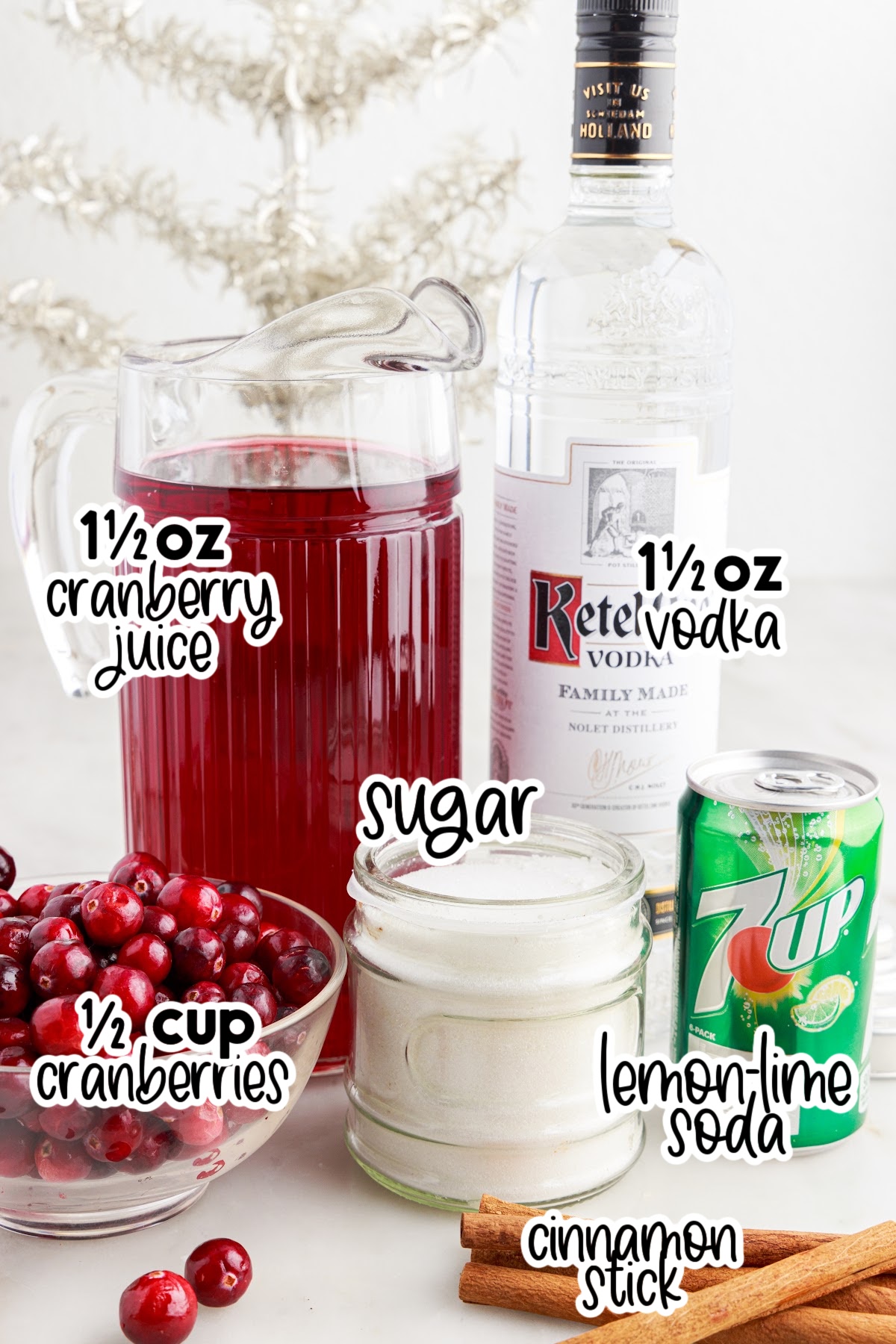 Ingredients needed to make Christmas Cranberry Cocktails with text overlay.