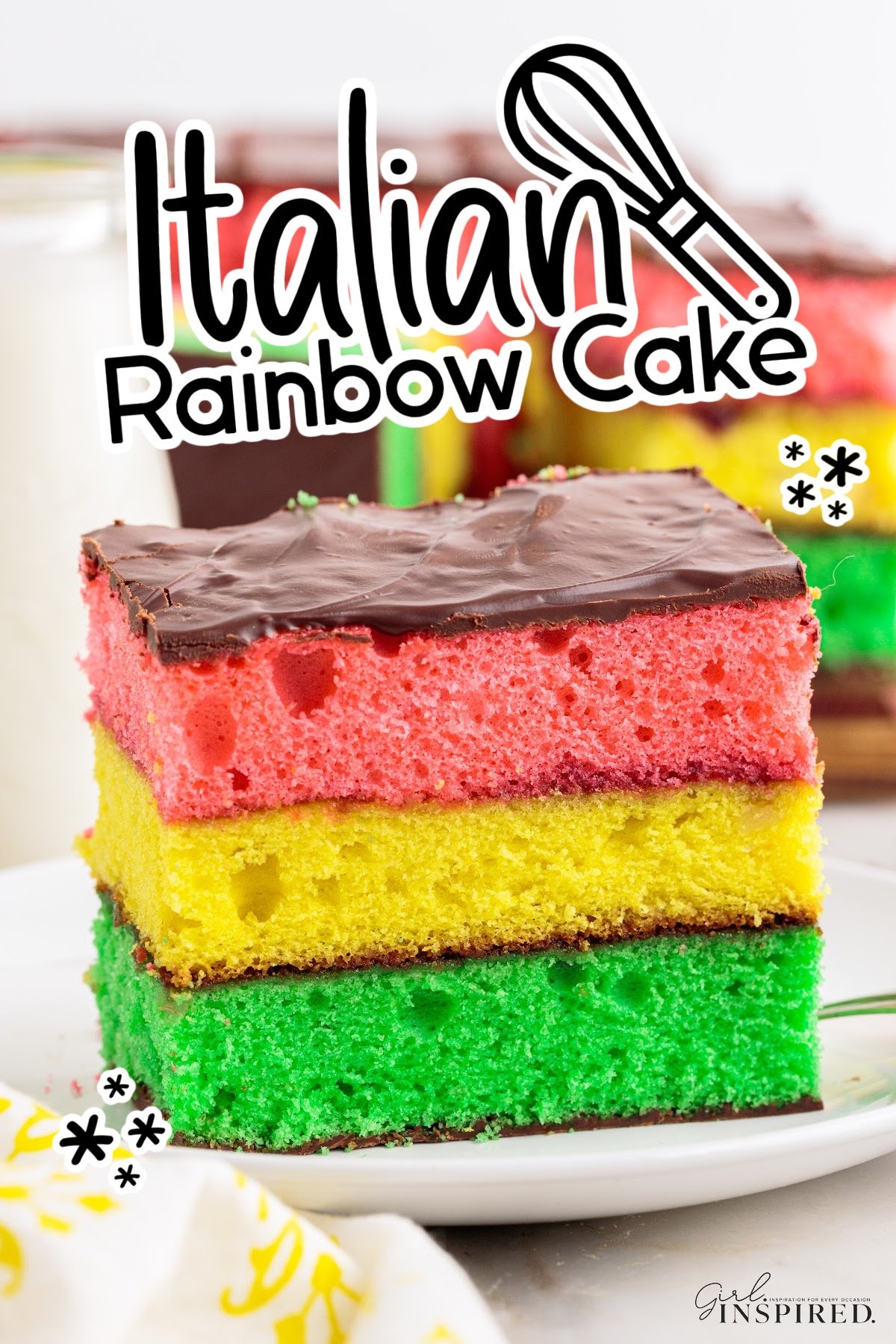 Front close up of a slice of Italian Rainbow Cake with text overlay.