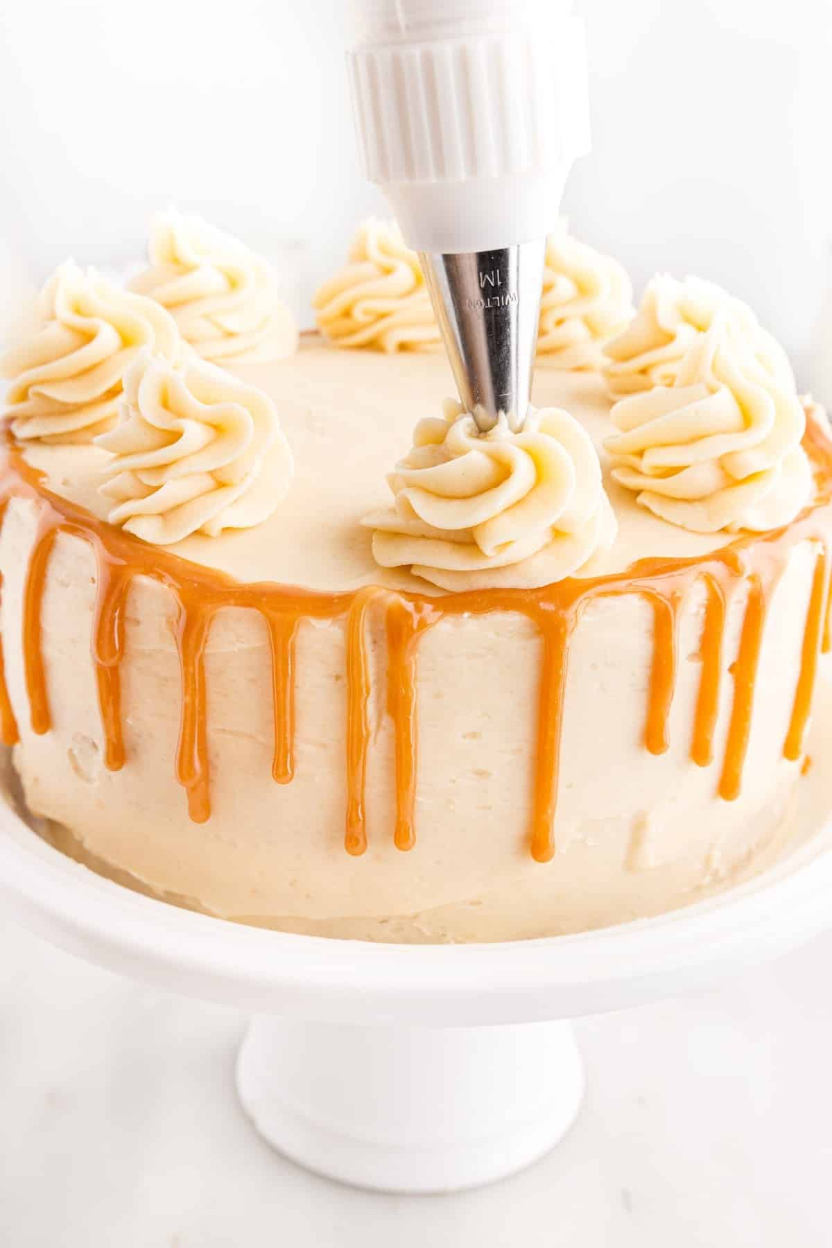 Icing dolloped on Butterscotch Cake.