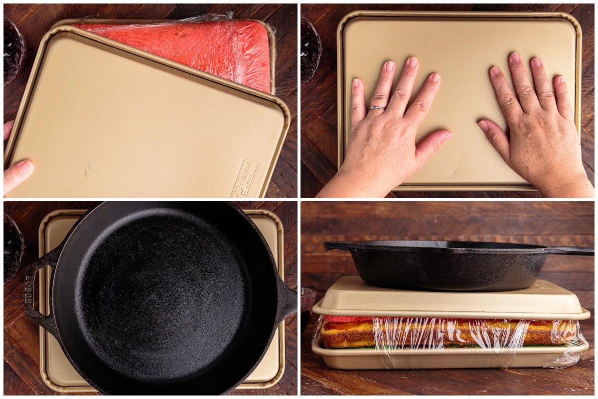 Pans pressing down layers of cake.