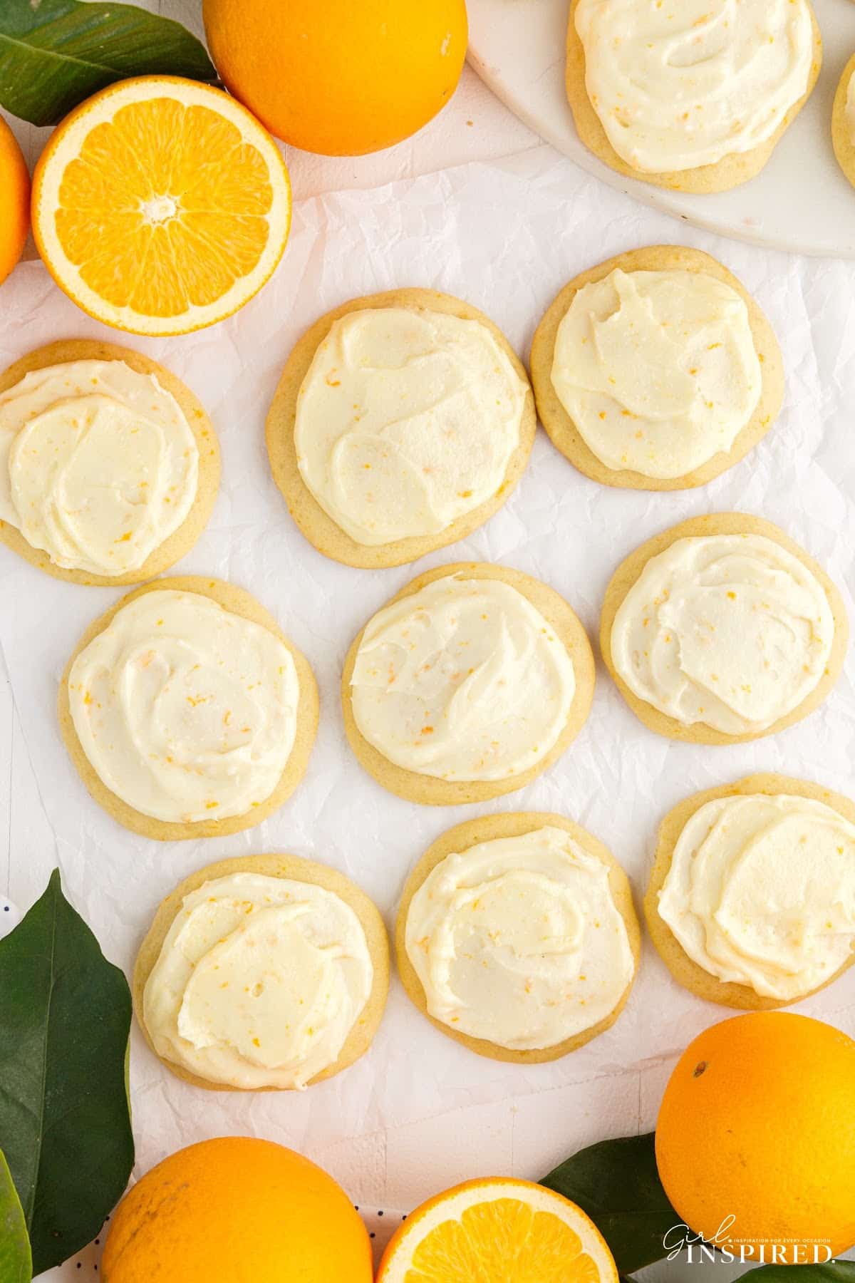 Overhead view of Orange Cookies next to oranges.