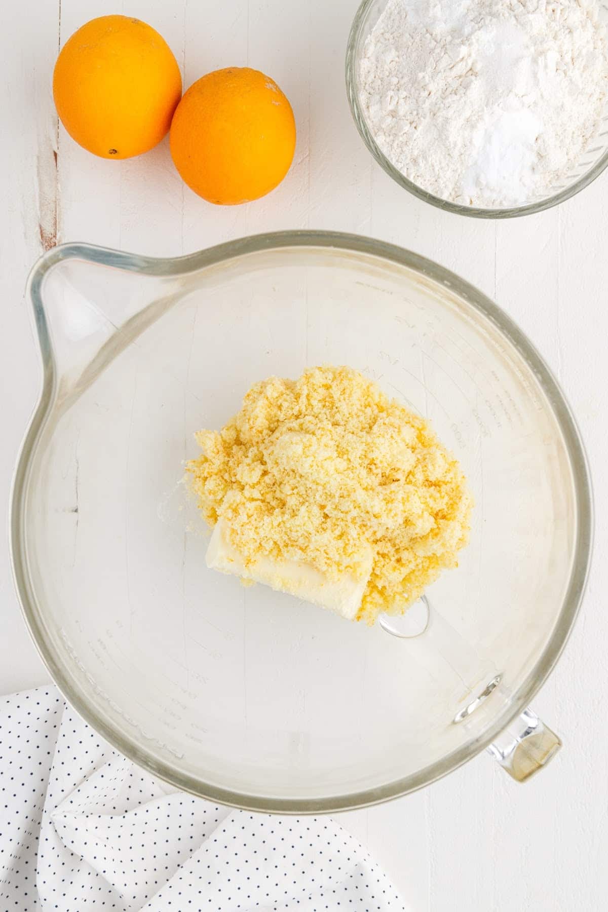 Softened butter and sugar in a bowl.