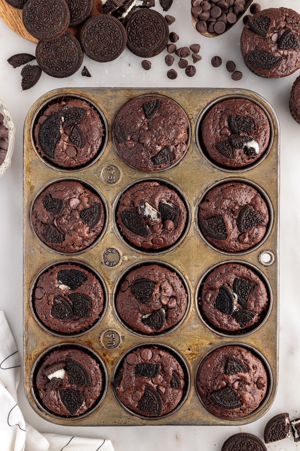 Overhead view of Oreo Muffins in a muffin tin.