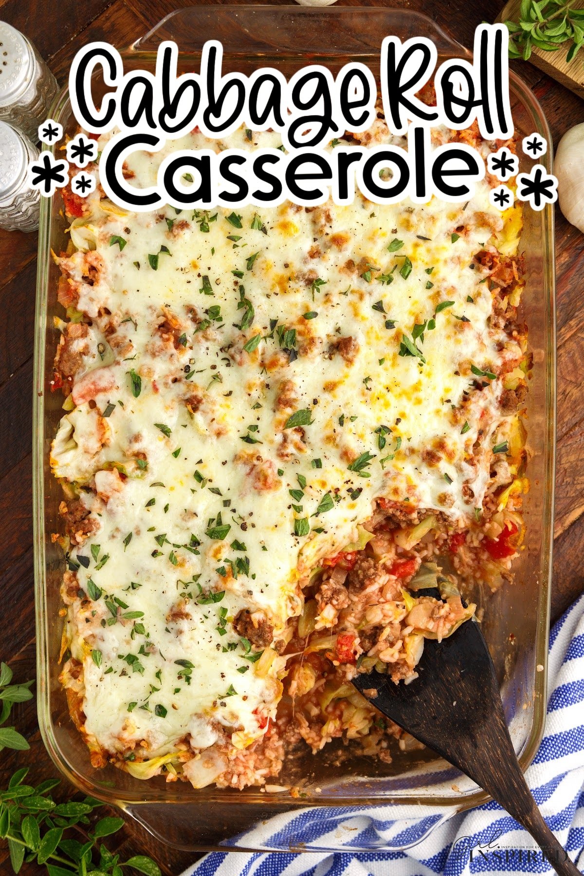 Overhead view of a 9x13 dish of Cabbage Roll Casserole with a serving missing with text overlay.