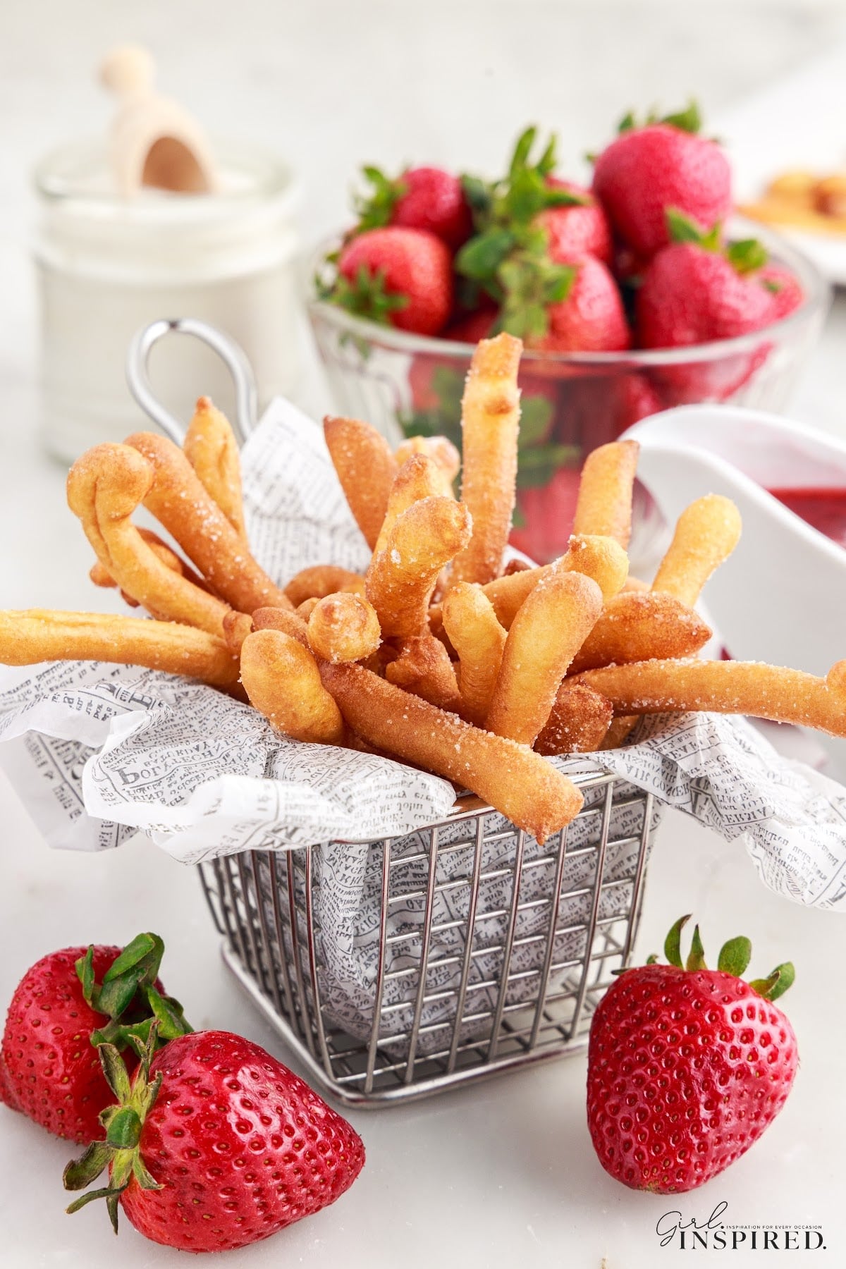 A small basket of Funnel Cake Fries.