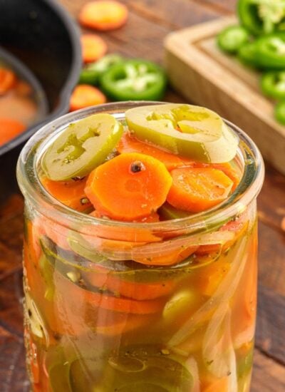 Close up of a jar of Pickled Jalapeños and Carrots.