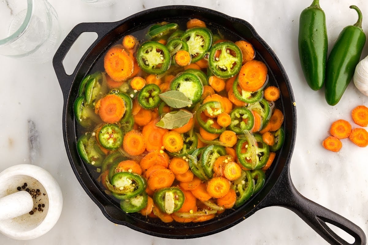 Bay leaves added to the skillet.