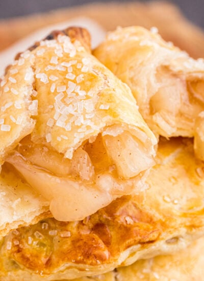 Cut open Apple Hand Pie with sugar sprinkled on top.