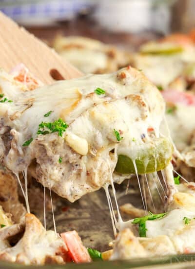 Philly Cheesesteak Casserole on a wooden spoon.