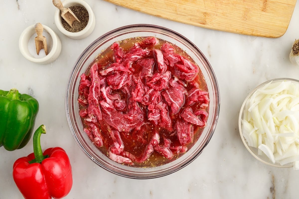 Steak slices in marinade.