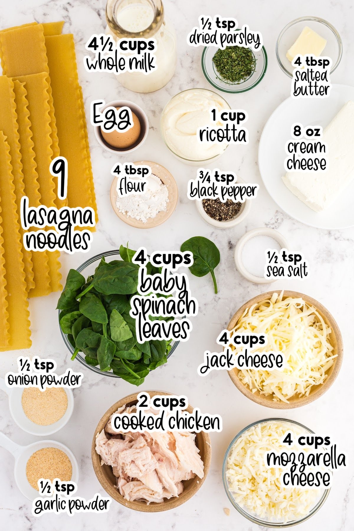 Individual ingredients for White Chicken Lasagna set out in bowls with text labels.