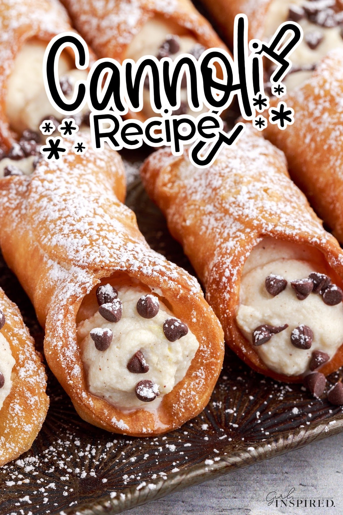 Completed Cannoli's dusted with powdered sugar and text overlay.