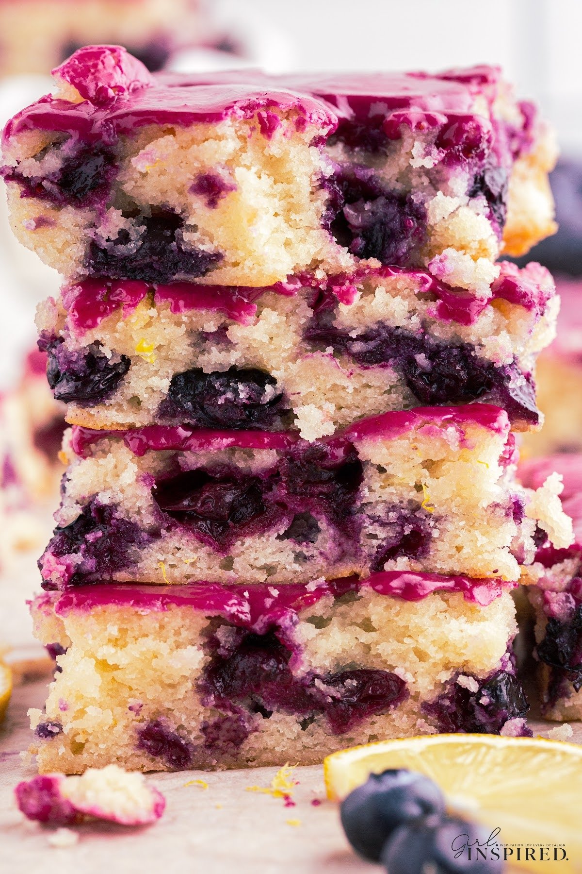 Four vertically stacked Lemon Blueberry Blondies.