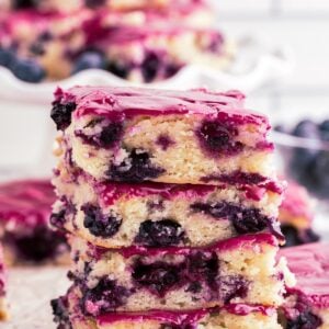 Four vertically stacked Lemon Blueberry Blondies.