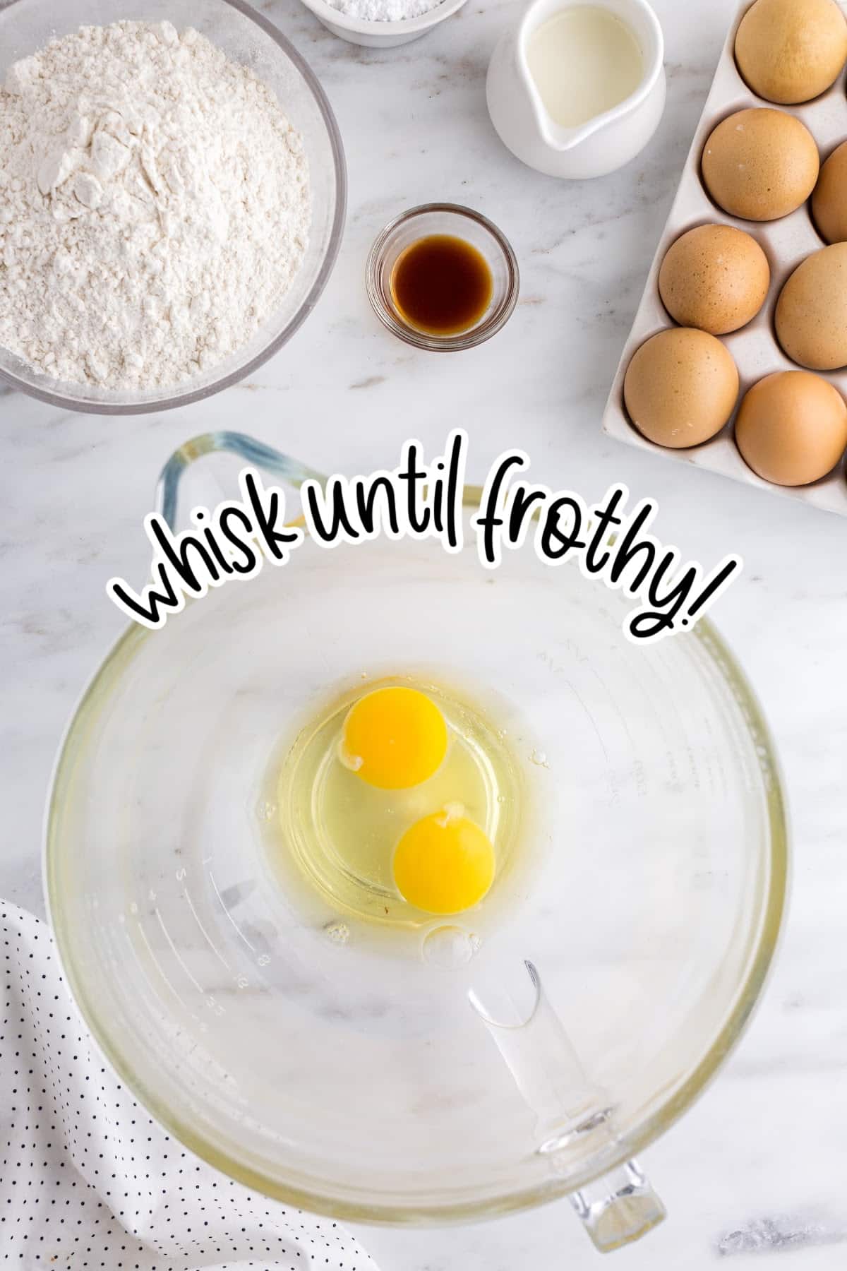 Eggs in a bowl being whisked until frothy.