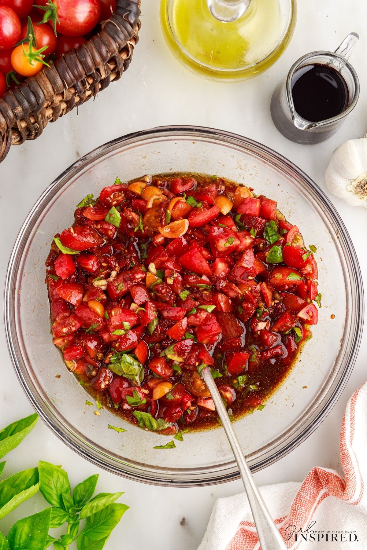 The Sundried tomato bruschetta topping in a glass mixing bowl.