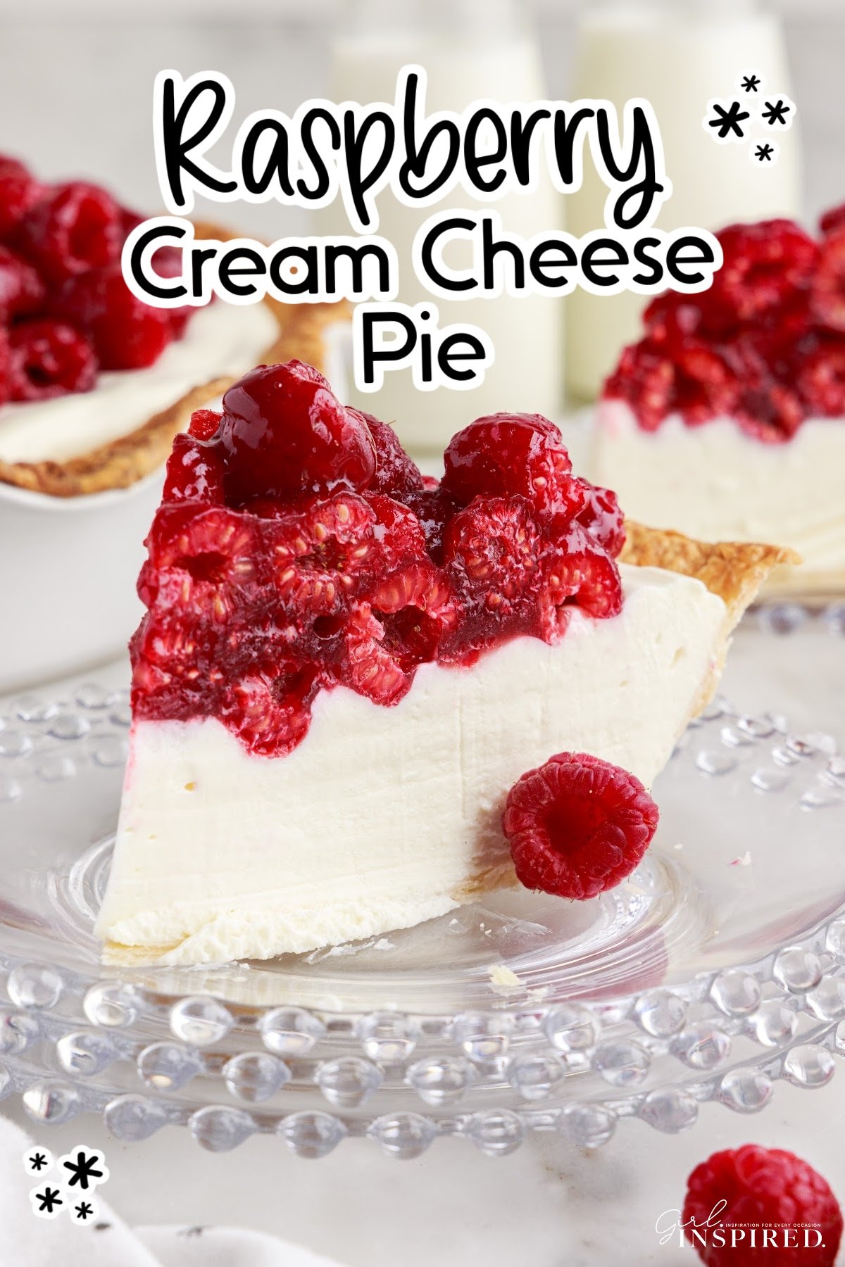 A slice of Raspberry Cream Cheese Pie on a plate with berries on top and text overlay.