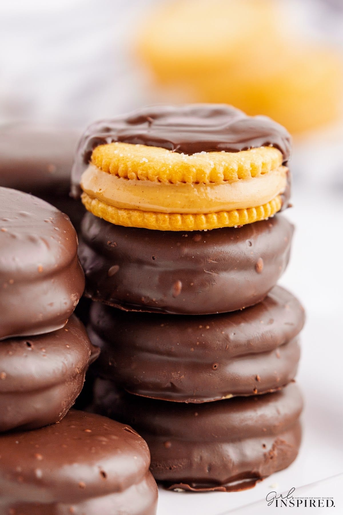 Stacks of Chocolate Dipped Peanut Butter ritz crackers showing the insides, with text overlay.