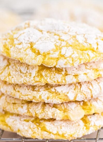 A stack of cool whip cookies on a cooling rack.