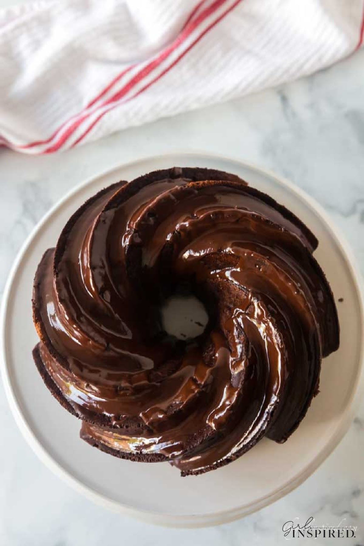 Overhead view of Double Chocolate Fudge Cake on a cake platter.