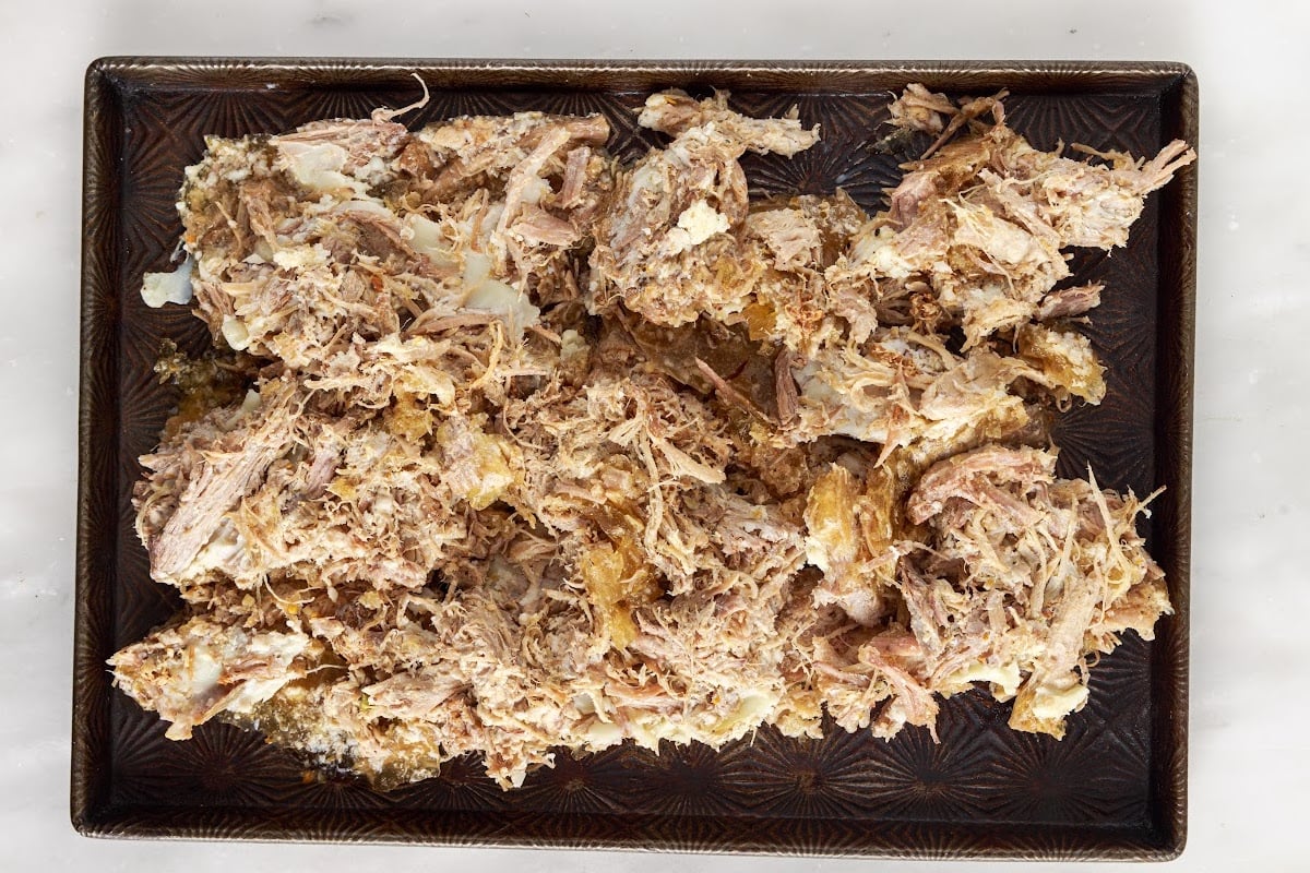 Completed pork shredded and on a platter to serve.