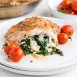 Stuffed Pork Chop on a plate showing the cheese and spinach mixture.
