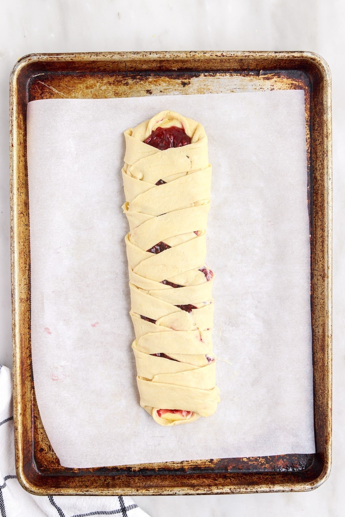 folding the dough cut sides over the filling.