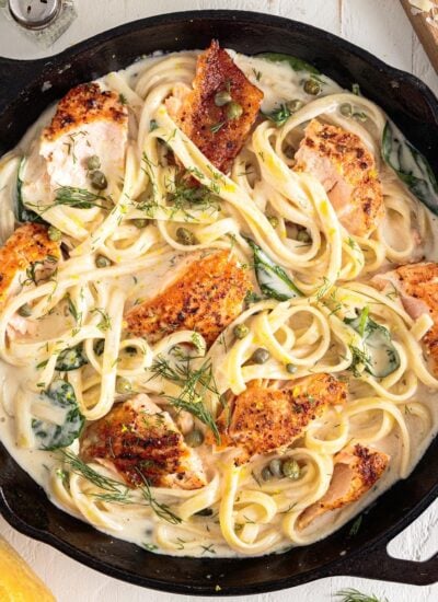 Creamy Salmon Pasta in a skillet, with text overlay.
