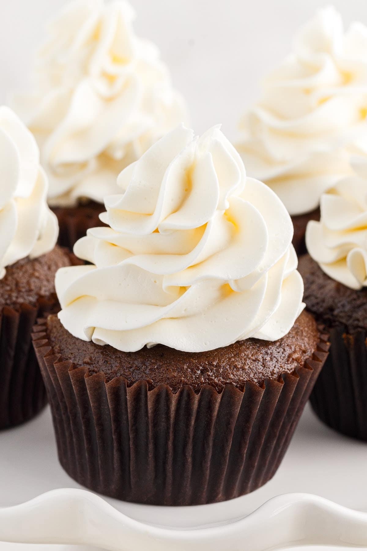 Close up of cupcakes topped with Marshmallow Cream Frosting.