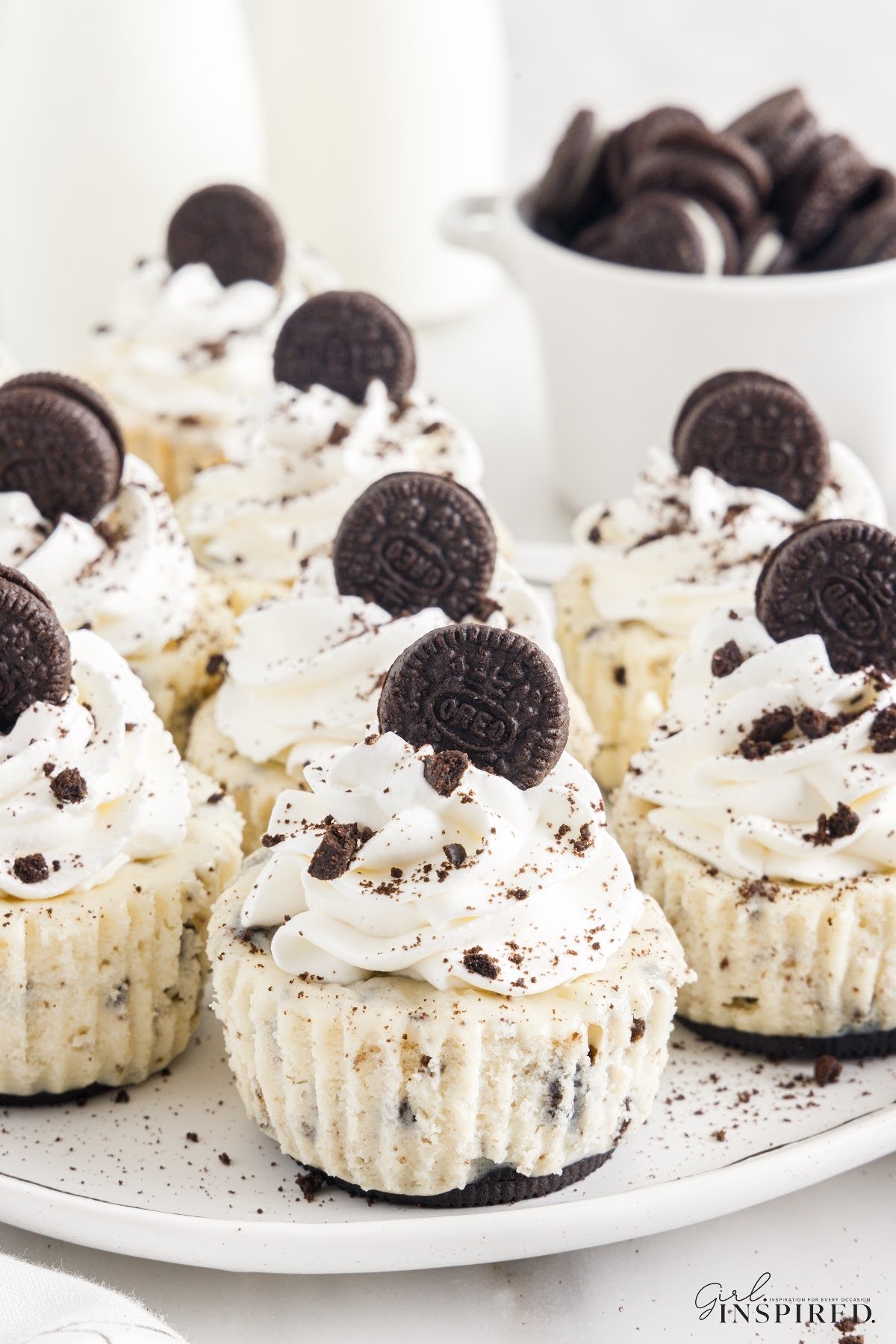Mini Oreo Cheesecakes on the counter, decorated and ready to eat.