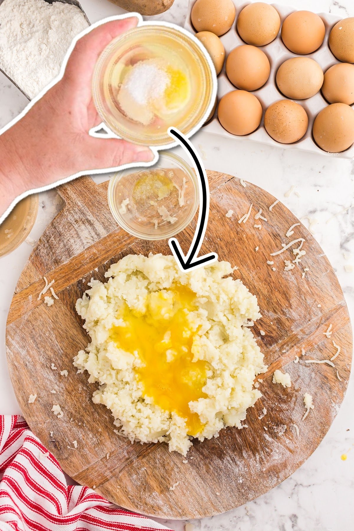 Adding eggs and ricotta to the mashed potatoes.