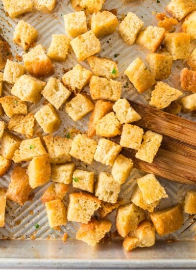 Homemade Sourdough Bread Croutons on a cutting board.