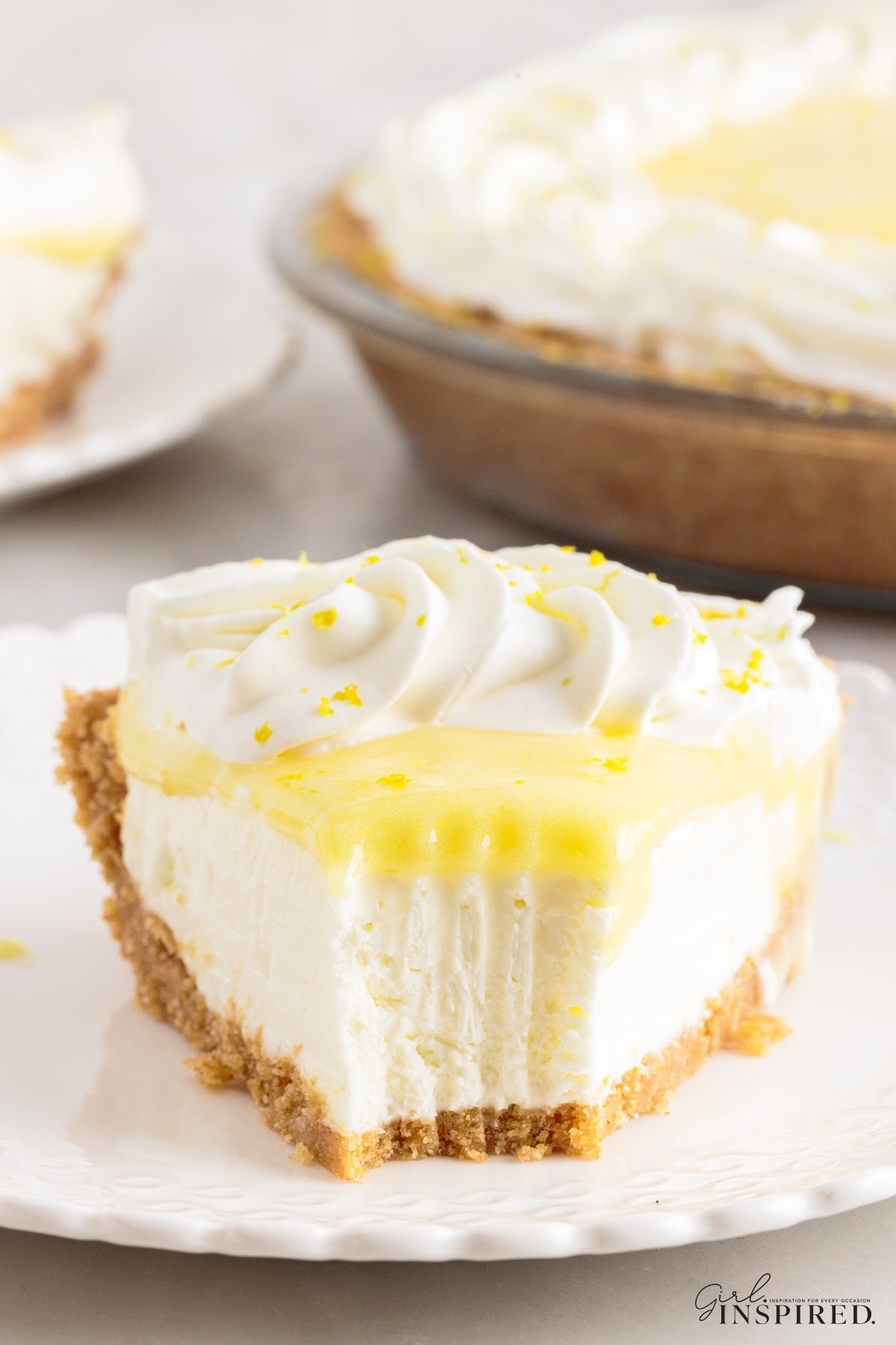 A slice of Lemon Cream Cheese Pie on a plate to serve.
