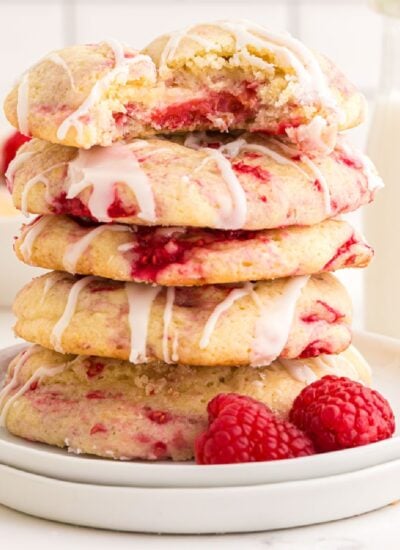 Lemon Raspberry cookies in a stack, showing the raspberry berries throughout.