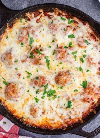 Skillet filled with Meatball Parmesan, ready to serve.