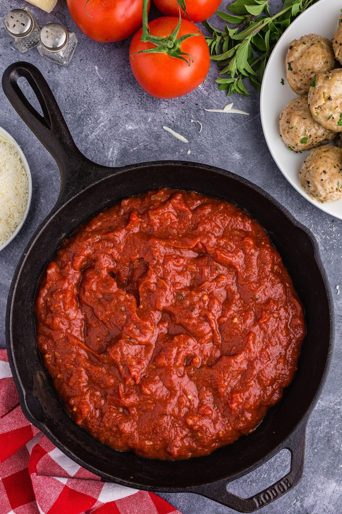 Marinara sauce in a skillet being warmed up.