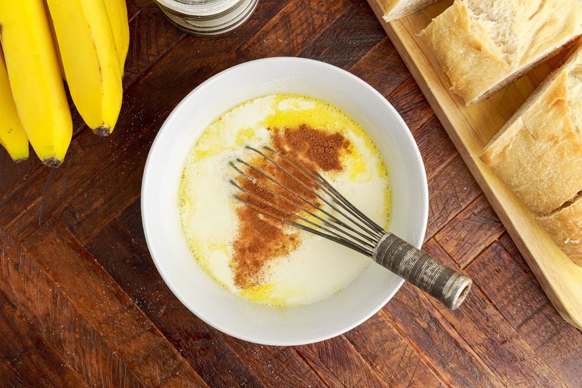 Mixing the egg mixture for the bread to be dipped into.