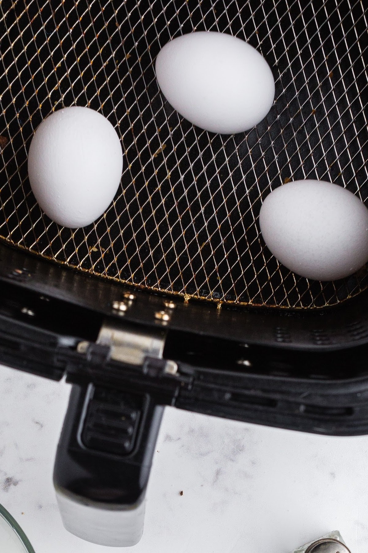 Place eggs in the air fryer.