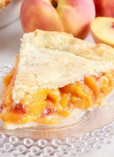 Since of Fresh Peach Pie on a plate.