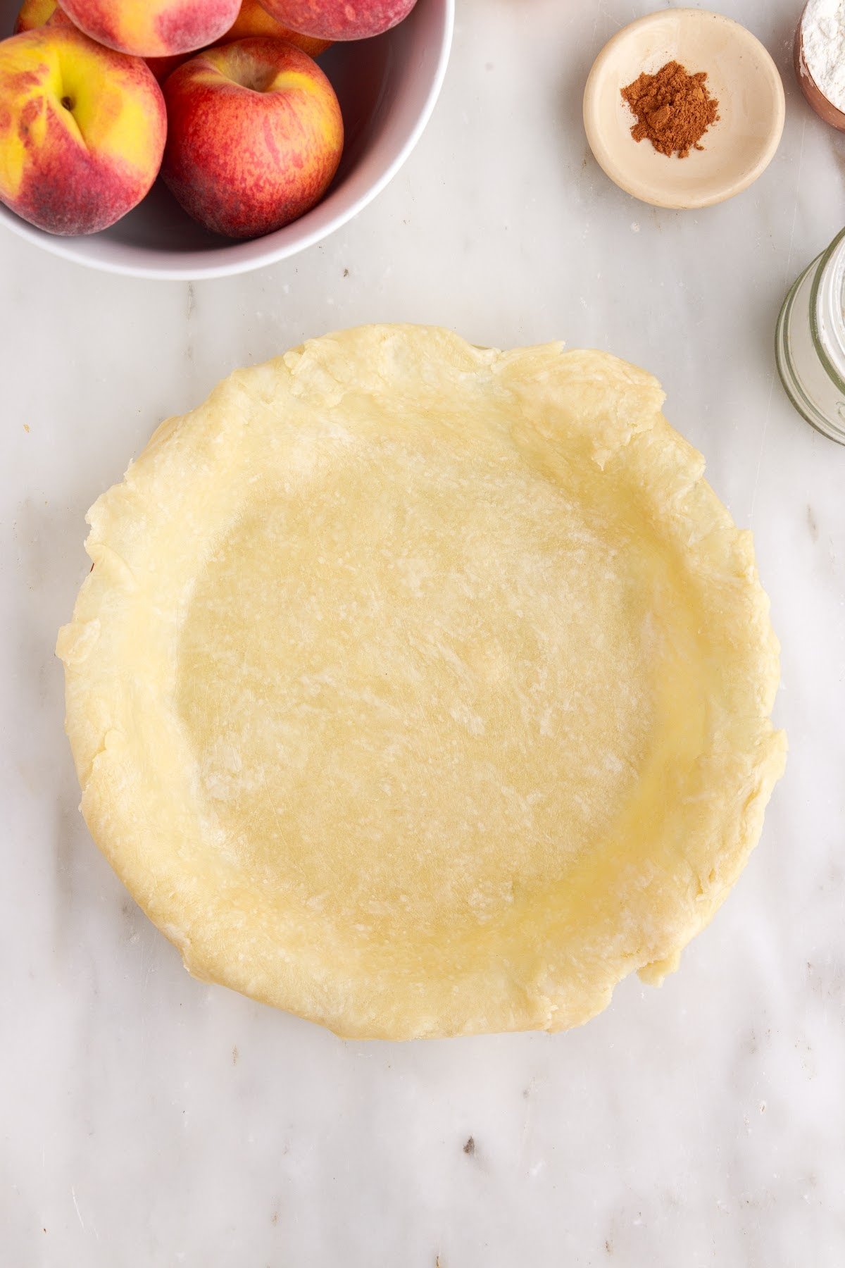 Pie dough on the bottom of the pie dish.