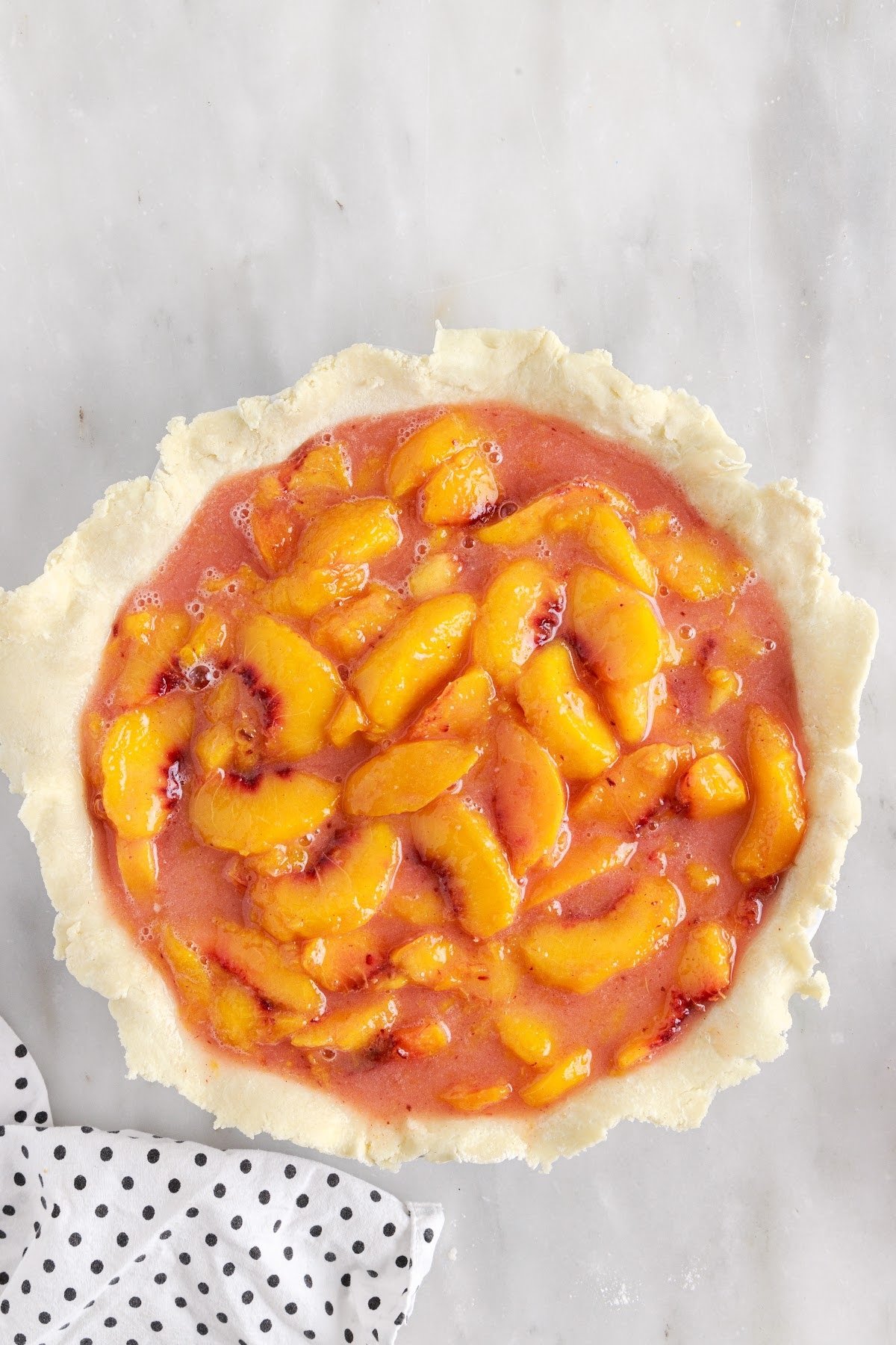 Peach mixture poured into the pie crust.